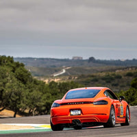 Porsche Cayman T with RVRN forged wheels on track, showcasing lightweight performance and custom design at Laguna Seca 2025.
