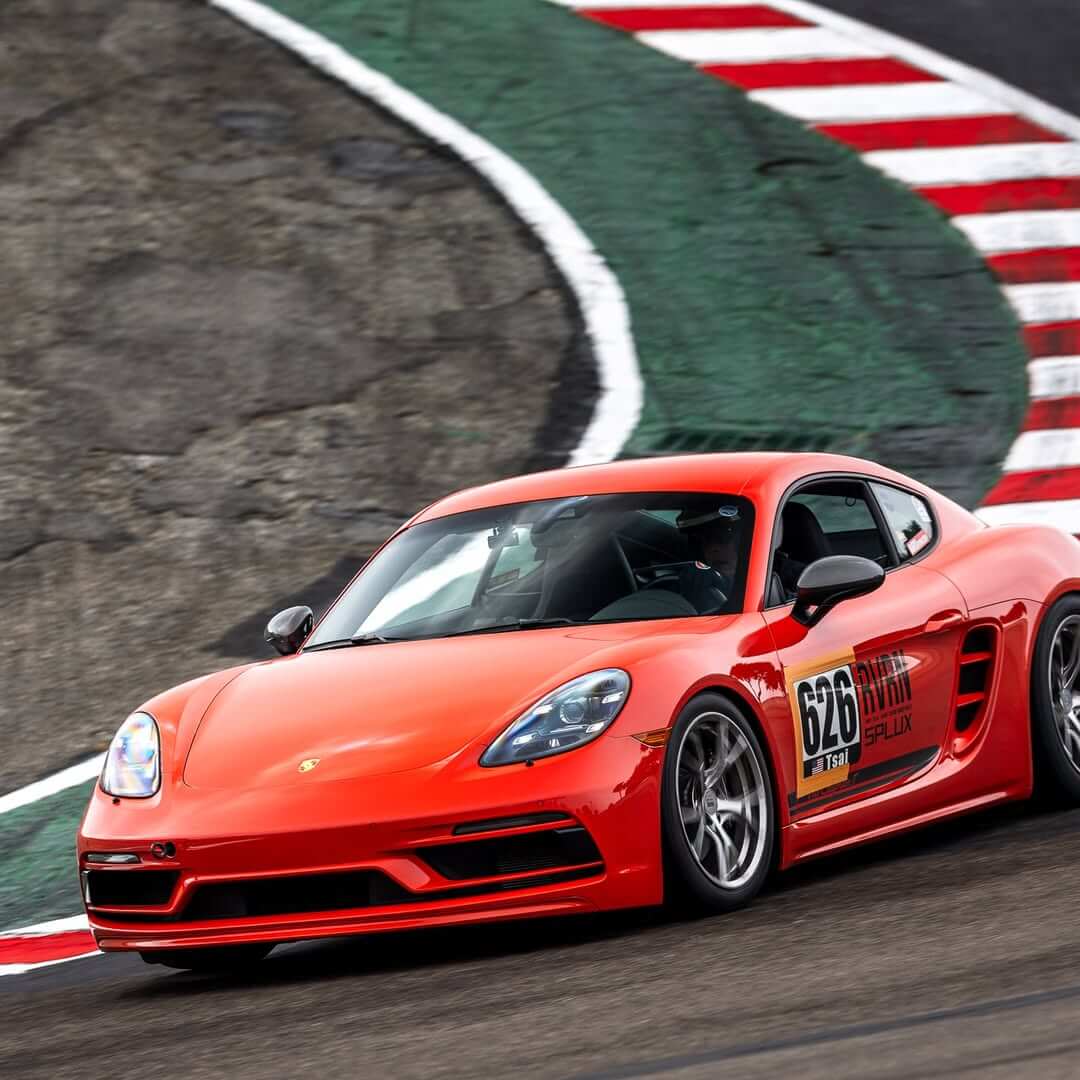 Porsche Cayman T with RVRN forged lightweight wheels at Laguna Seca 2025, showcasing performance and track-tested design.