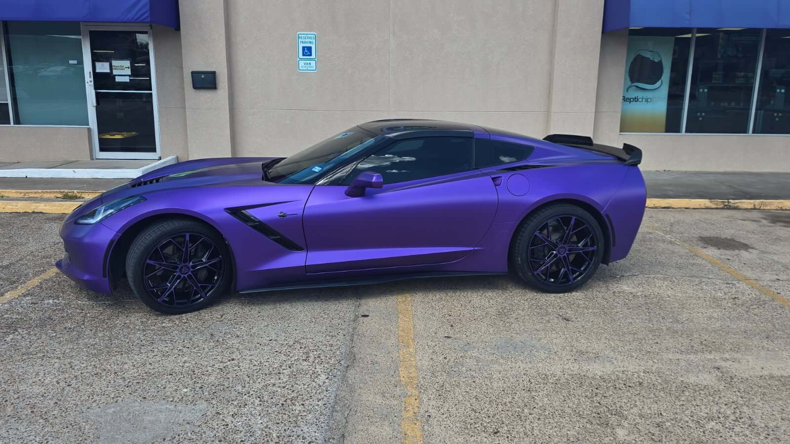 2015 Corvette C7 Stingray with purple and black RVRN RV-MR20 series forged wheels parked on a city street.