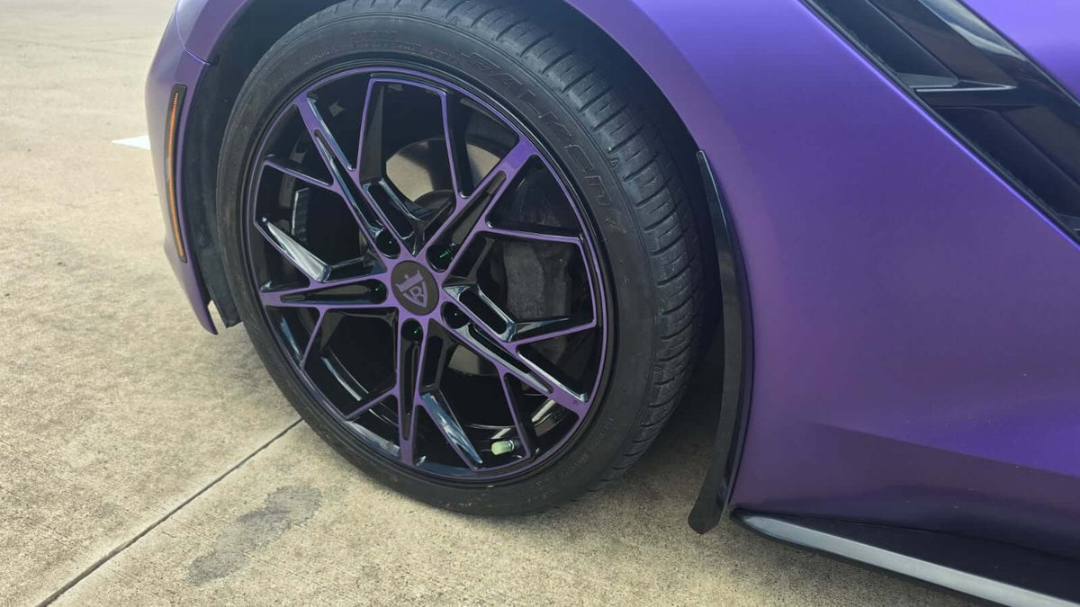 Close-up of a purple and black wheel on a 2015 Corvette C7 Stingray with RVRN RV-MR20 series design.