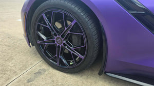 Close-up of a purple and black wheel on a 2015 Corvette C7 Stingray with RVRN RV-MR20 series design.