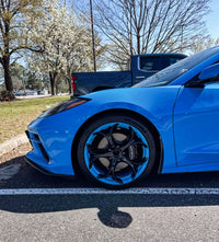 Side view of 2024 Corvette C8 Stingray equipped with MS016 custom forged wheels in Rapid Blue and black, showing aggressive stance and precise fitment.