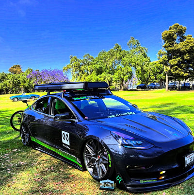Front fitment of 20x9.5 forged aftermarket wheels on Tesla Model 3, custom-built performance setup