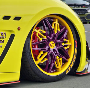 Forged wheel spoke detail on Maserati 20" rims in yellow and purple, premium custom wheel machining