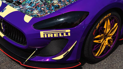 Detail view of deep-lip forged wheel showing yellow and purple color, Maserati GranTurismo best wheels styling