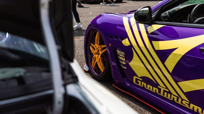 Close-up of 20x10.5 rear custom forged rims on Maserati MC Centennial, yellow and purple wheels finish