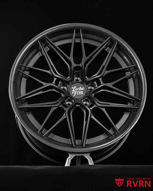 RV-C081 multi-spoke carbon fiber-look forged wheel in a matte black finish for 2022 Tesla , featuring a central 'Leche Fria' logo and an 'RVRN' watermark in the bottom right corner, set against a solid black background.