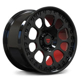 Studio photograph highlighting the deep gloss black finish and vibrant red contrast on the RV-MF03 aero wheel for performance vehicles.