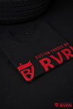 Folded black RVRN T-shirt with red front logo and crew-neck construction.