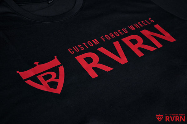 Close-up of the red RVRN Custom Forged Wheels logo printed on a black T-shirt.