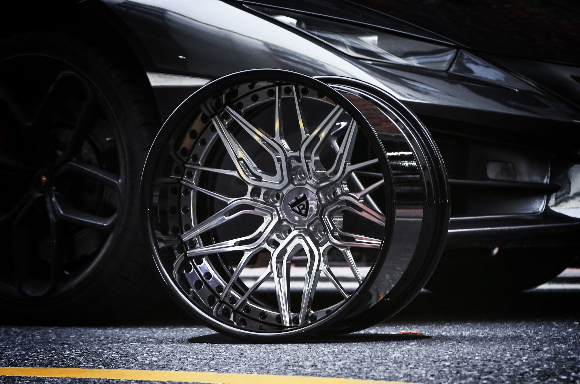 RVRN custom 2-piece forged wheels RV-T081 featuring a deep lip profile, intricate mesh design, and premium exposed titanium hardware for Corvette C8.