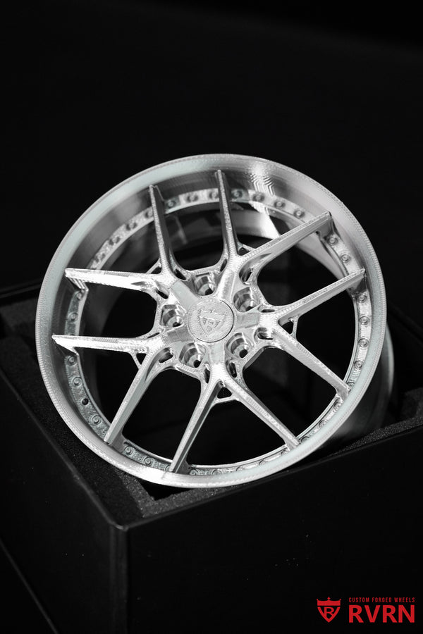 Close front view of a silver RVRN Custom Forged Wheels 3D-printed wheel model.