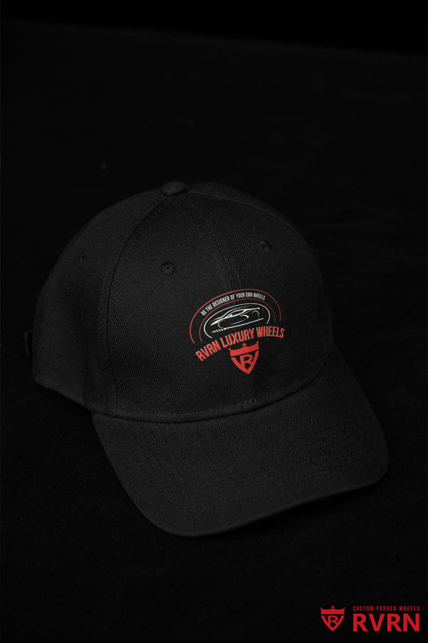 Angled view of the black RVRN Custom Forged Wheels baseball cap with curved brim and branded front graphic.