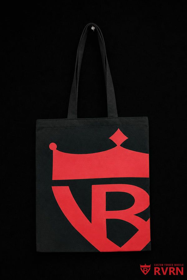 Front of the black RVRN Custom Forged Wheels canvas tote bag with oversized red crown shield graphic.