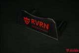 Angled view of the black RVRN Custom Forged Wheels display plaque with red RVRN logo and brand slogan.