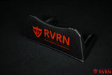 Angled view of the RVRN Custom Forged Wheels carbon-fiber-pattern display plaque with red RVRN branding.