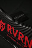 Close-up of the carbon-fiber-pattern surface and red RVRN Custom Forged Wheels logo on the display plaque.