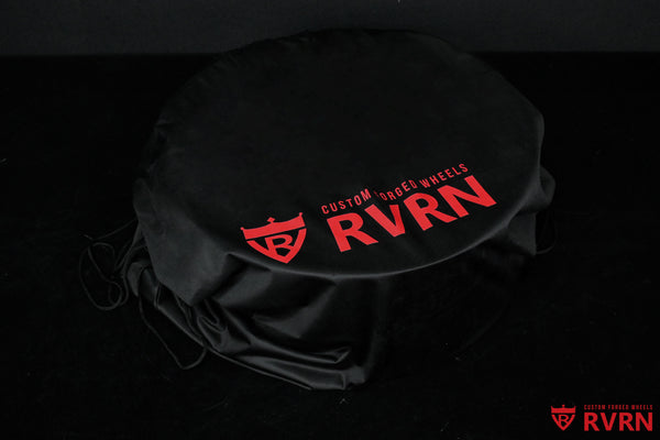 Black RVRN Custom Forged Wheels storage bag fitted over a wheel with red RVRN branding.