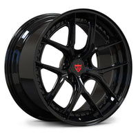 Corvette C8 black wheels, RVRN RV-DB179 full gloss black Y-spoke 2-piece forged wheels with red custom center cap logo angled view.