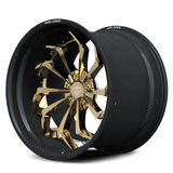 Nissan GT-R Nismo aftermarket wheels, RVRN RV-DC06 polished frozen gold face with genuine carbon fiber barrel directional twist angled view.