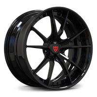 Chevrolet Corvette C8 custom black wheels, RVRN RV-DS477 gloss black 10-spoke 2-piece deep lip forged wheels angled view.