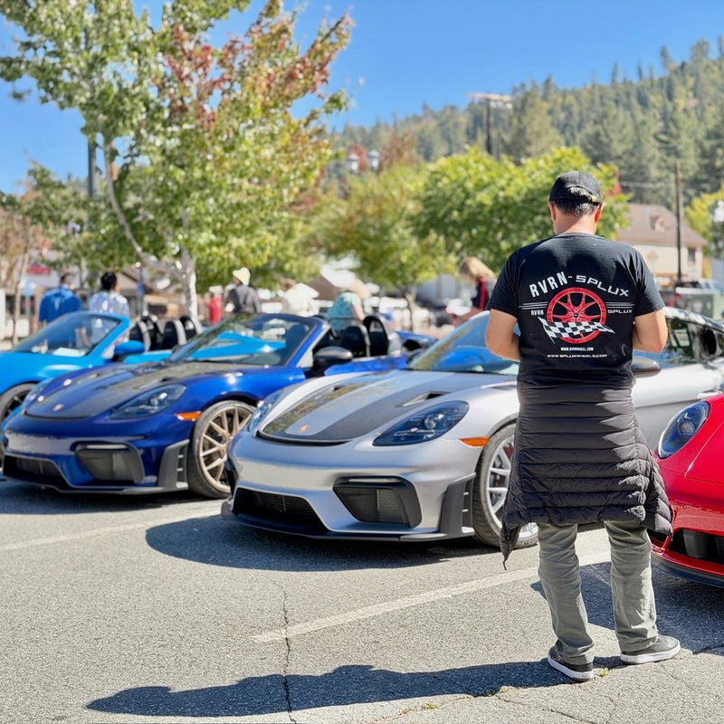 Display area featuring Porsche models and RVRN forged wheels.