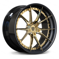 Aston Martin 10 spoke custom wheels in a gold, black and carbon fiber wrapped lip combination for a striking appearance