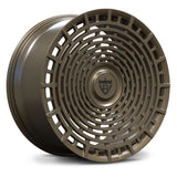 A single multi-spoke alloy wheel rim in a matte dark bronze finish, shown at a three-quarter angle on a clean white background.