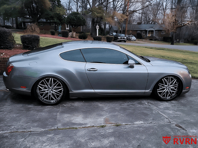 2006 Bentley Continental GT with custom RVRN deep dish forged wheels parked outdoors.