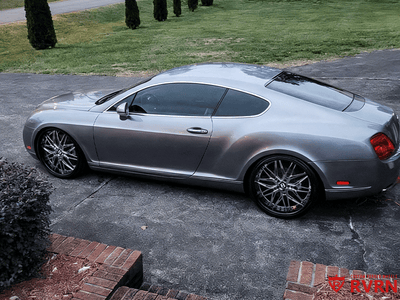 2006 Bentley Continental GT showcasing custom forged RVRN deep dish wheels parked in a driveway.