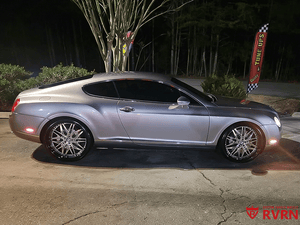 2006 Bentley Continental GT with custom forged RVRN deep dish wheels, showcased at night in a striking silver finish.