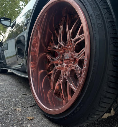 Front angle of Lexus IS350 on RVRN T081 wheels, 19x10.5 / 19x12 setup, polished rose gold, showcasing bold concave profile and premium finish.