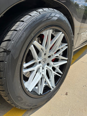 Close-up of the pearl white concave RVRN RV-C081 wheel on a black 2018 Dodge Ram 1500 Sport RT, gloss black barrel and red brake caliper