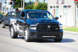 Front three-quarter view of a black 2018 Dodge Ram 1500 Sport RT rolling on RVRN RV-C081 concave wheels with pearl white spokes