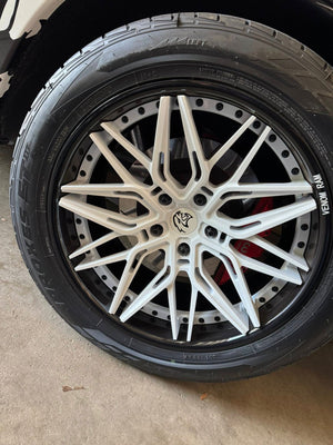 Close-up of the RVRN RV-C081 pearl white concave wheel and RVRN FORGED engraving on a 2018 Dodge Ram 1500 Sport RT