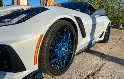 Corvette ZR1 with custom polished blue forged wheels, featuring a carbon fiber lip, showcasing RVRN RV-T081 design.