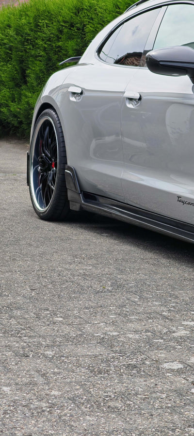 Custom forged RVRN Wheels showcased on a sleek vehicle in a vibrant vehicle gallery setting.