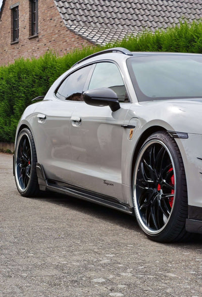 Custom forged RVRN Wheels showcased on a sleek, modern vehicle parked on a scenic street in the RVRN Vehicle Gallery.