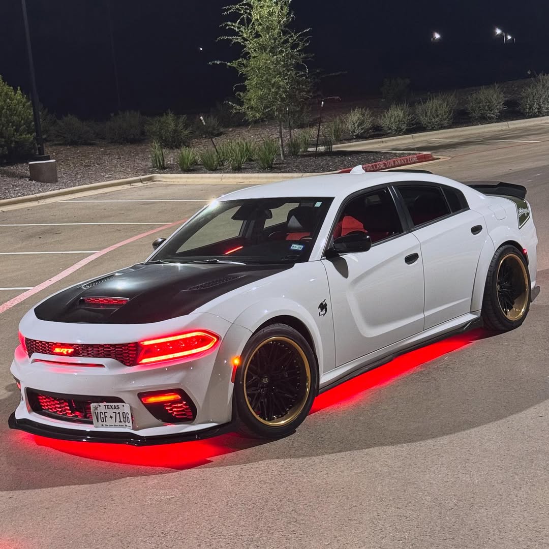 White 2023 Dodge Charger Scat Pack Widebody on 22-inch gold and black RVRN Forged deep dish wheels