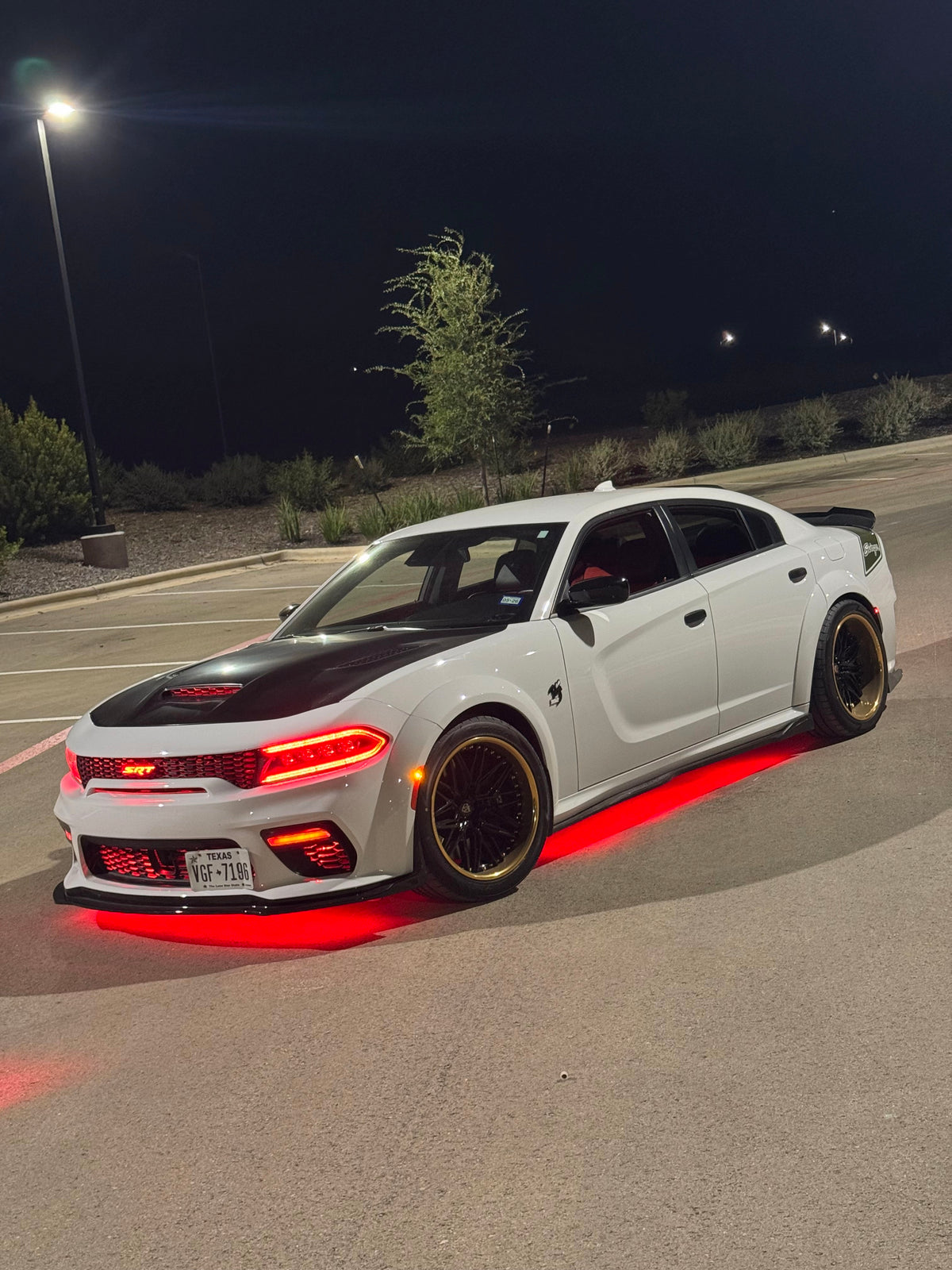 Close-up of gold and black RVRN Forged 22-inch deep dish wheel on Dodge Charger Scat Pack