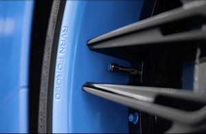 Detailed view of the RVRN FORGED engraving on the Rapid Blue barrel of an RVRN RV-T081 wheel on a 2025 Corvette C8 Z06