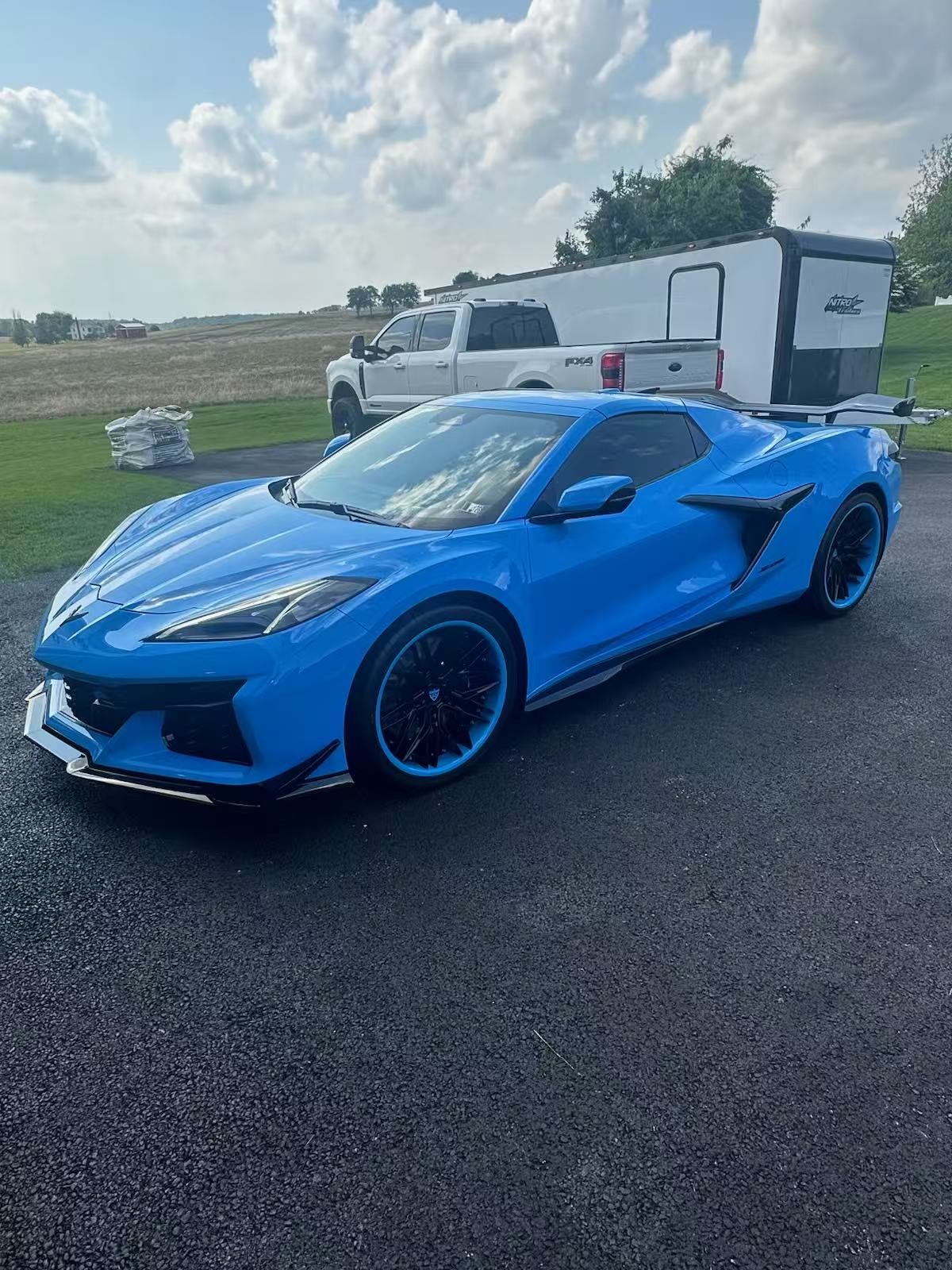 2025 Rapid Blue Corvette Z06 with RVRN forged wheels, showcasing deep concave design and custom performance elements.