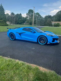 2025 Rapid Blue Corvette C8 Z06 with RVRN forged wheels, showcasing deep concave design and custom performance wheels.