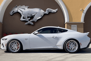 Full side view of a white 2024 Ford Mustang GT on RVRN RV-T081 deep dish custom forged wheels with pearl white polished spokes
