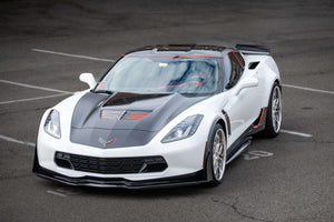 Front three-quarter view of a white 2015 Corvette C7 Z06 on RVRN RV-T081 polished aluminum deep dish wheels in an empty parking lot