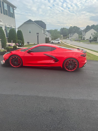 Angled view of 2023 Corvette C8 Z51 on RVRN RV-DC01 forged wheels, aggressive directional styling, 20x9 and 21x12 setup.
