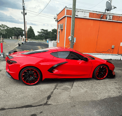 2023 Corvette C8 Z51 Torch Red on RVRN RV-DC01 custom forged wheels, front 20x9 +35mm and rear 21x12 +52mm, directional red-black design.