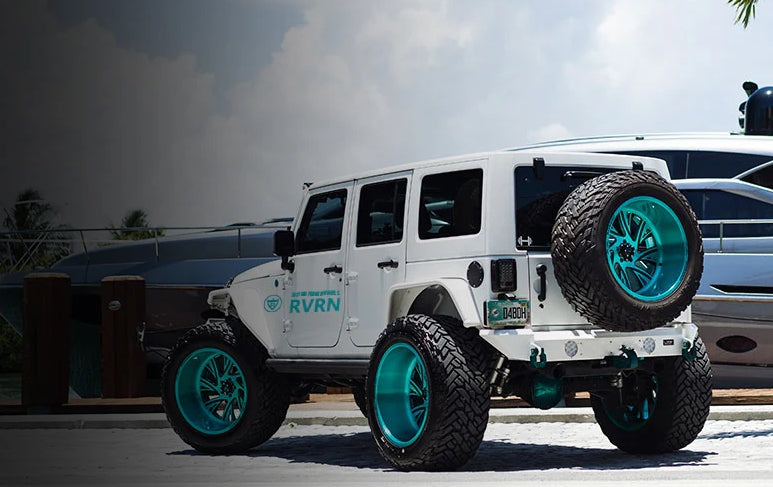 White Jeep Wrangler with deep dish forged rims on a road